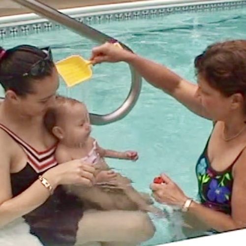 Miss Bea says the signal then pours water on a one year old baby's face to prepare for going under water during swimming lessons.